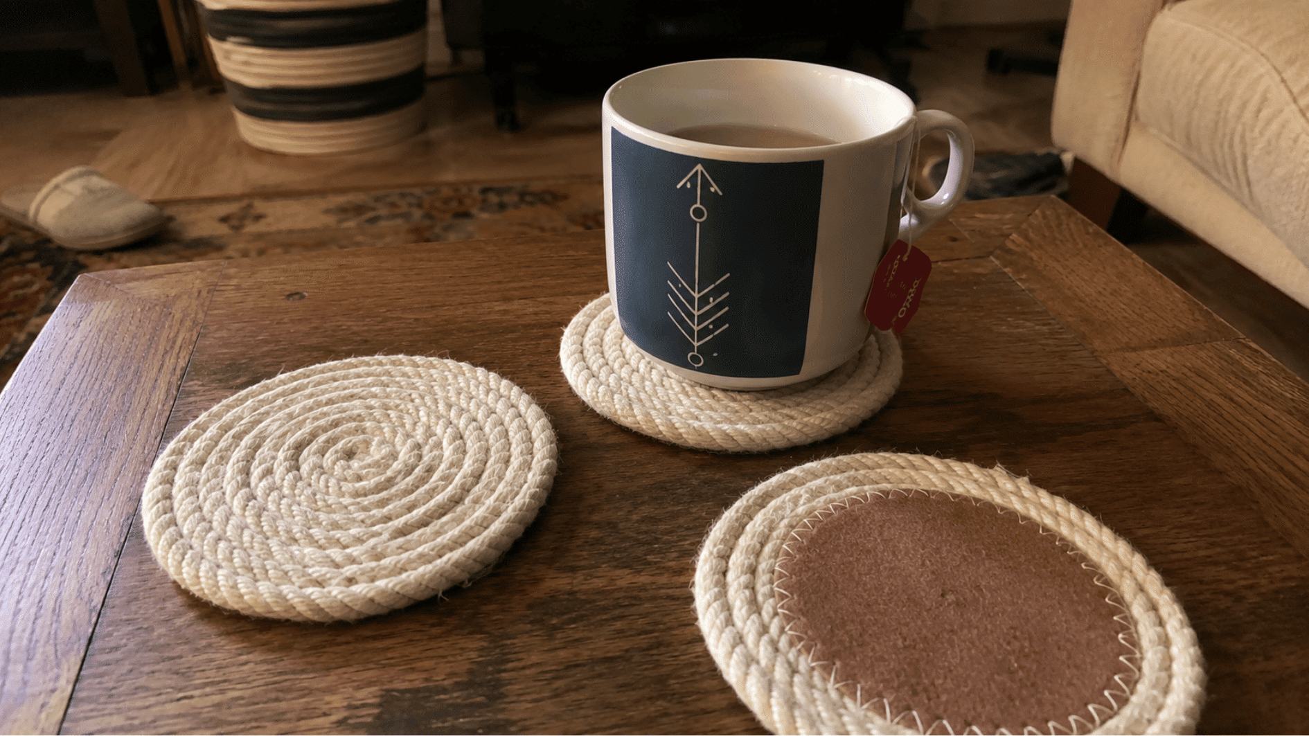 Cotton rope coasters with a tea mug on a coffee table.
