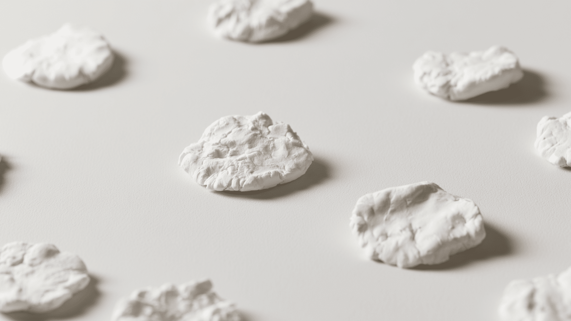 cornstarch and baking soda air dry clay tablets kept on a white background with neutral background visible shadows