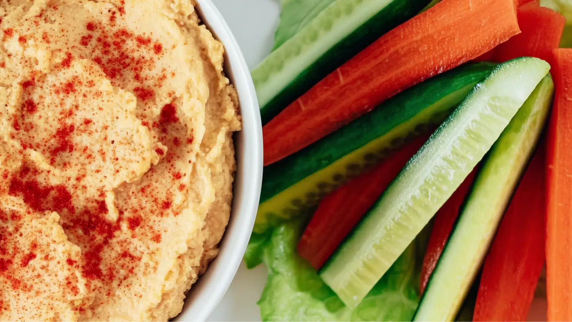carrot sticks served with hummus dip snack