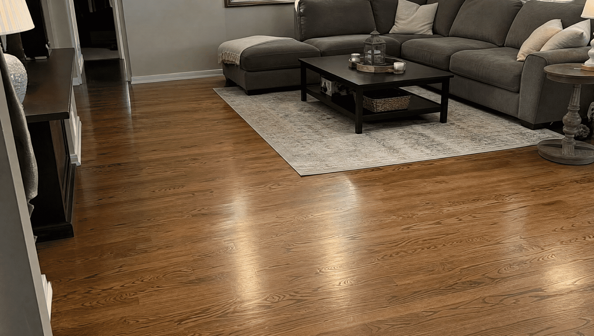 clean refinished wood flooring in a living room showing a simple home renovation update with natural details