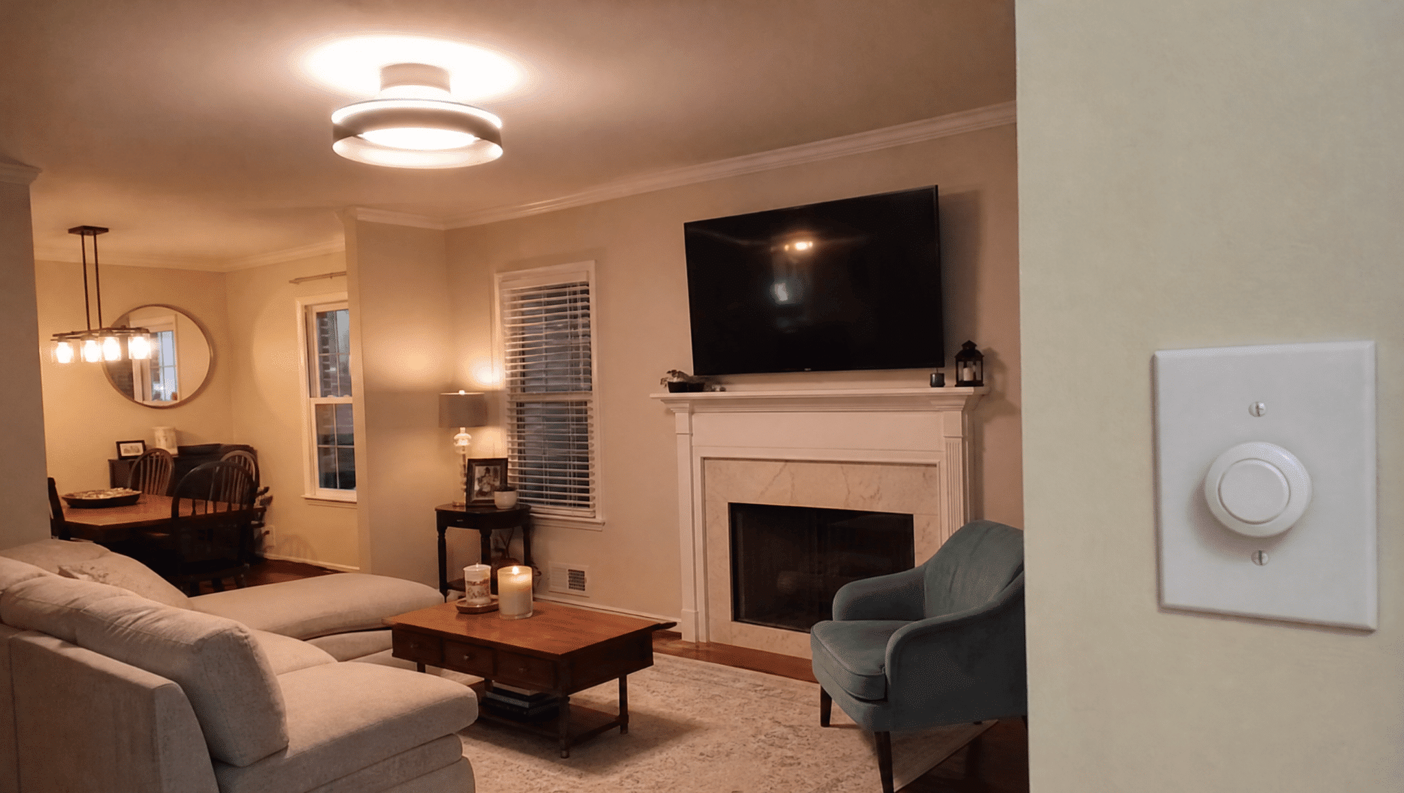 cozy living room with updated lighting fixture and dimmer switch for better home renovation results