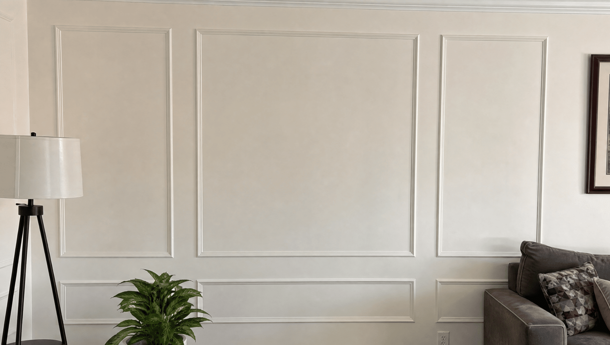 living room wall with decorative trim adding texture and character through a simple renovation update