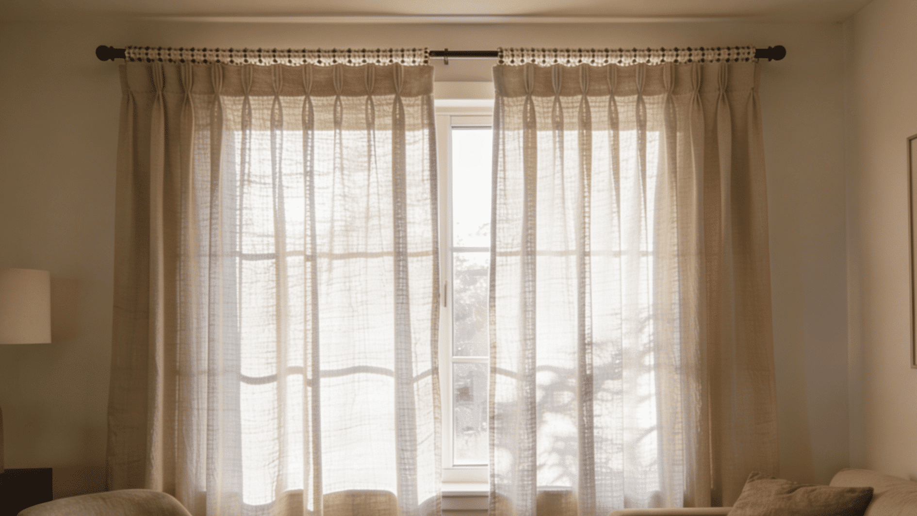 living room window with rod pocket curtains stitched channel at top soft gathered folds simple decorative interior (1)