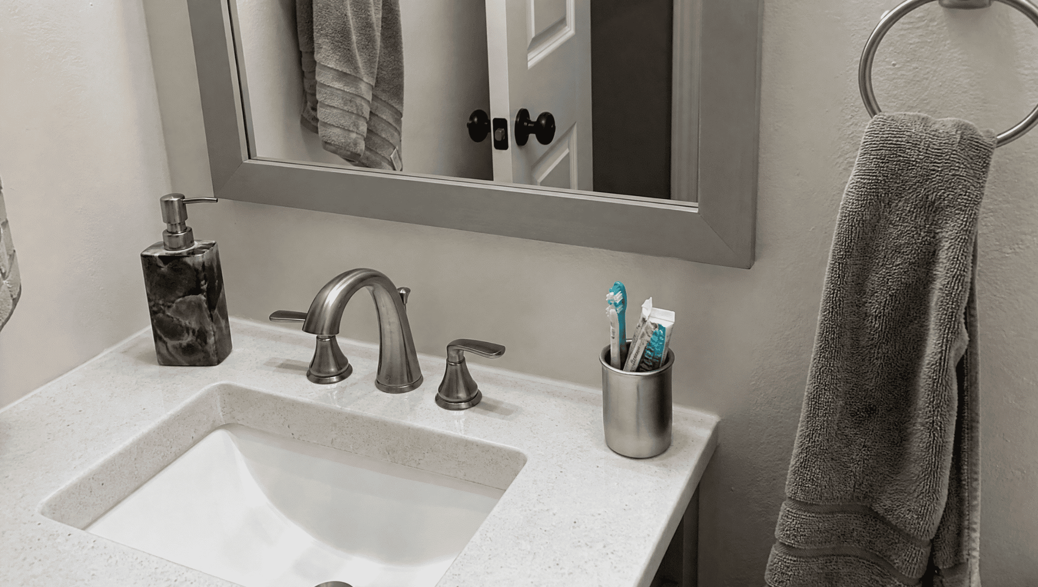 modern bathroom faucet replacement showing a simple fixture update for a budget home renovation