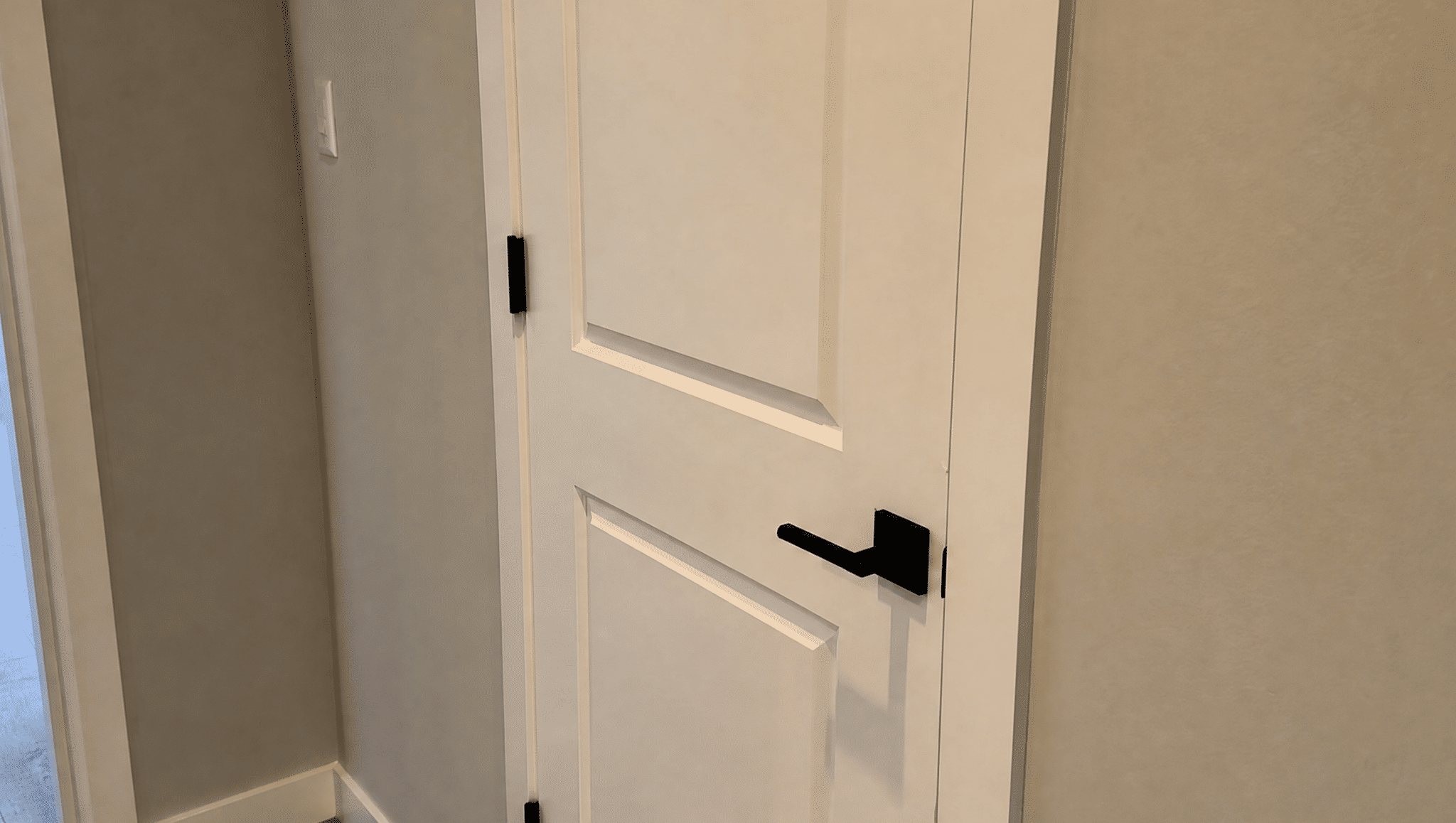 modern interior door with updated handle showing a small renovation change that improves home style