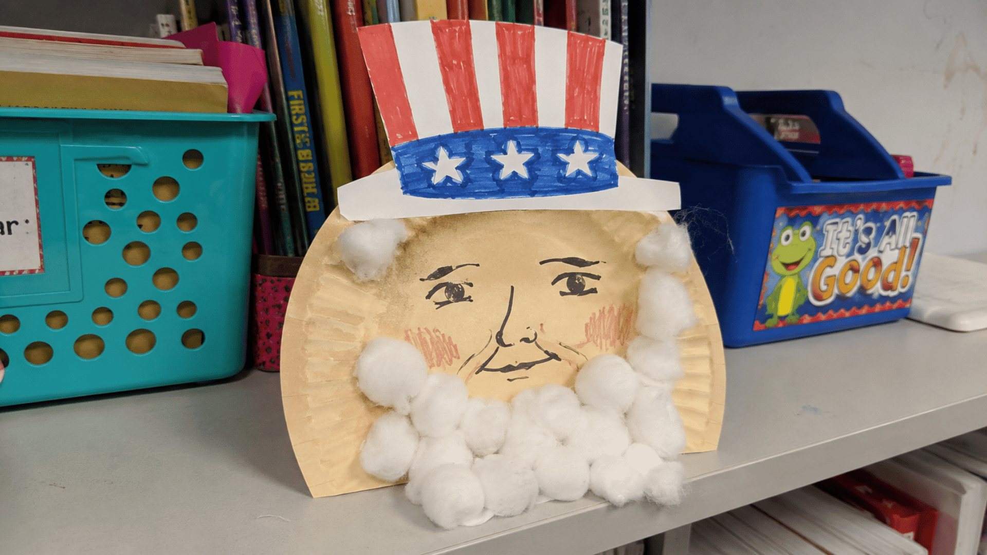 paper plate uncle sam craft with cotton beard on a classroom shelf