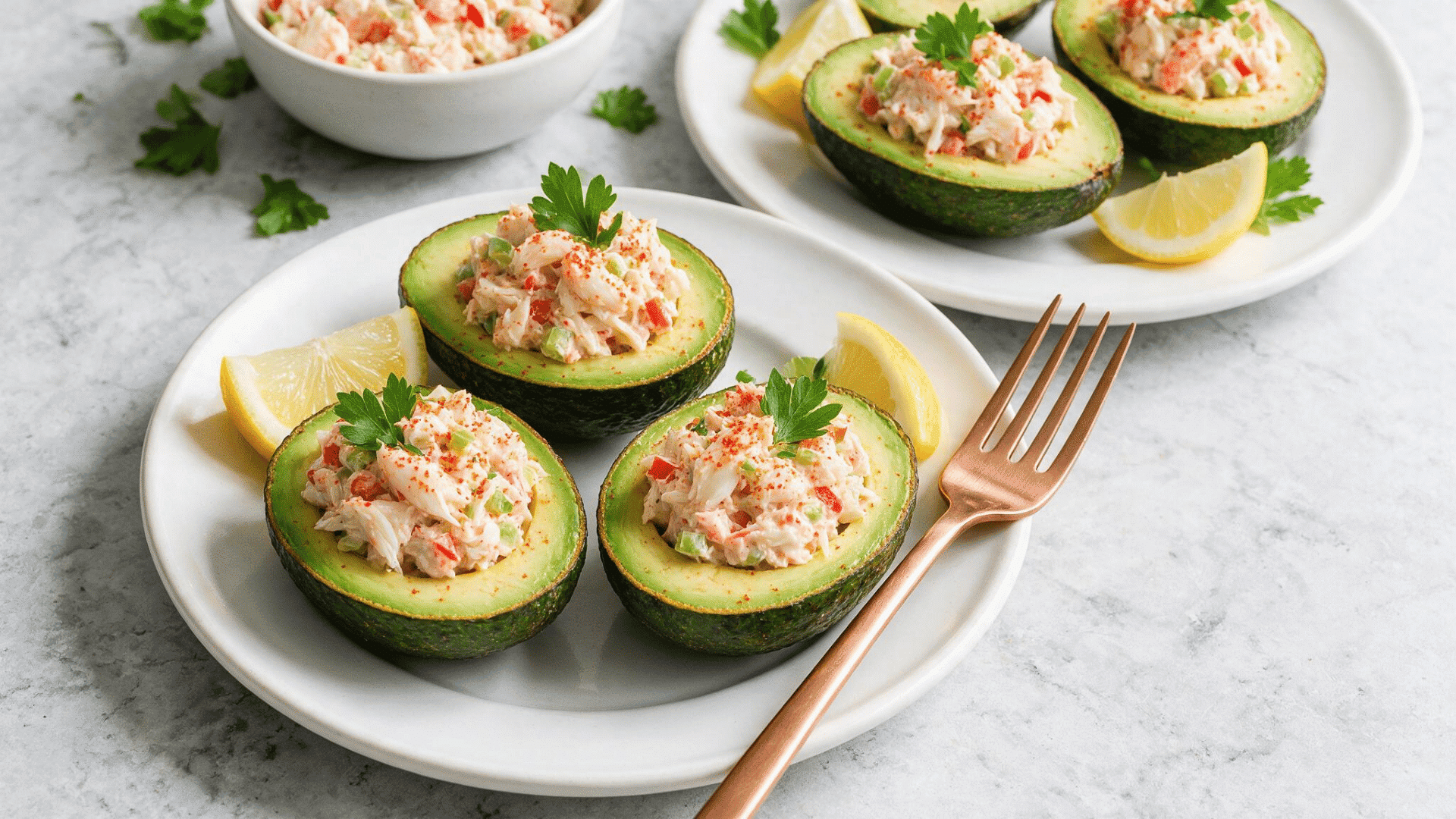 Crab stuffed avocado halves with lemon