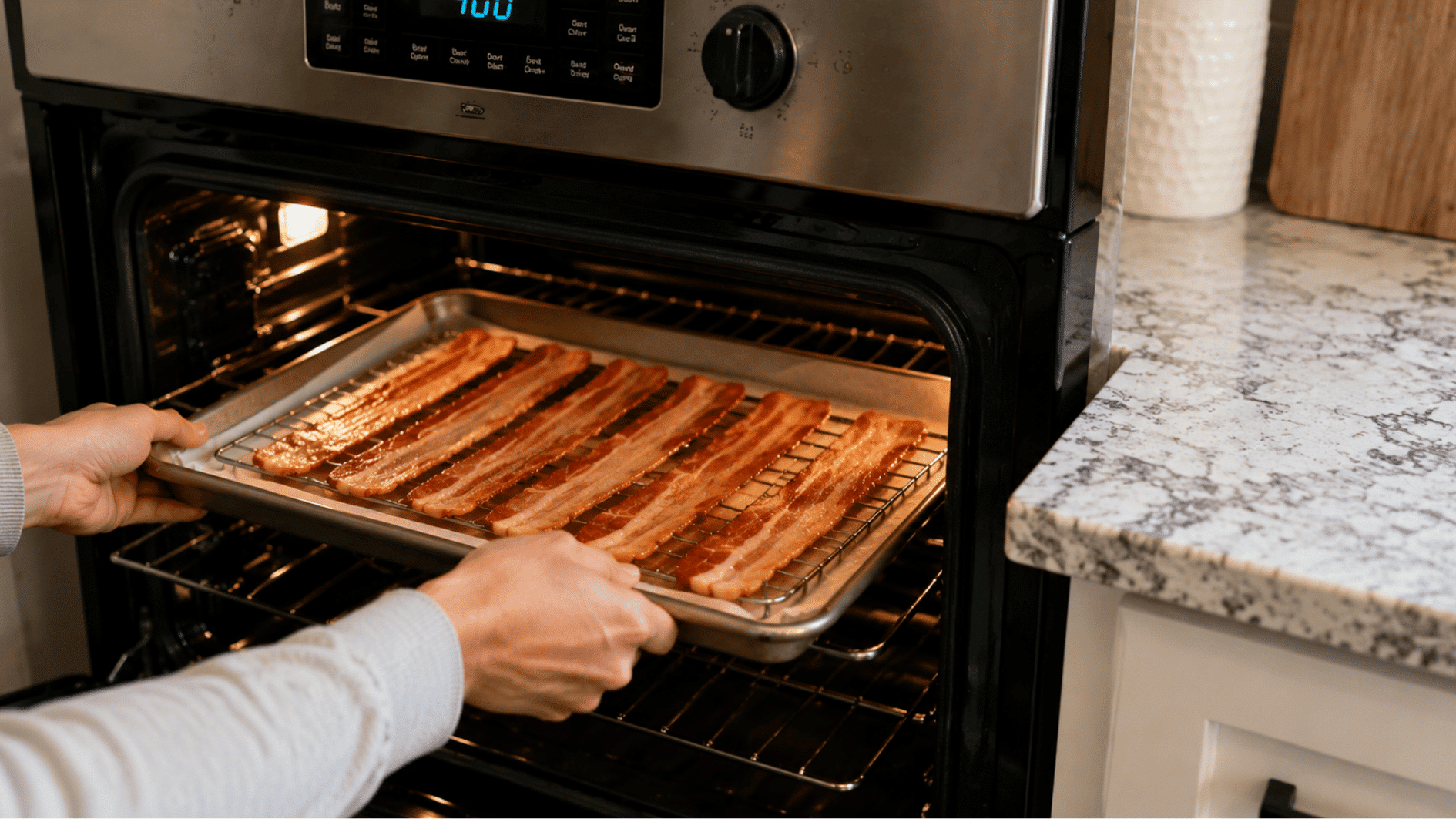 bacon baking on middle oven rack with edges turning golden brown
