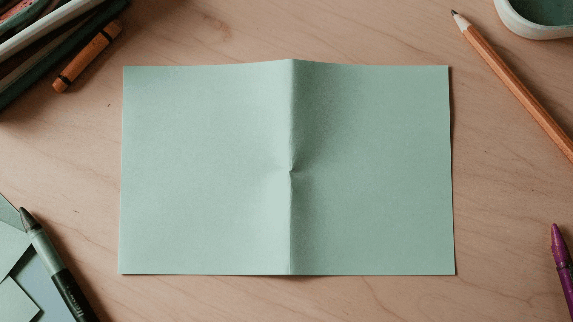 rectangular paper with a single center crease
